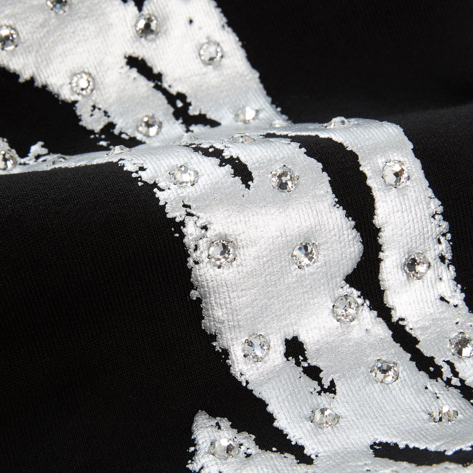 Black cotton fleece sweatpant with rhinestone "SP5DER" logo and sprayed-effect side stripe.