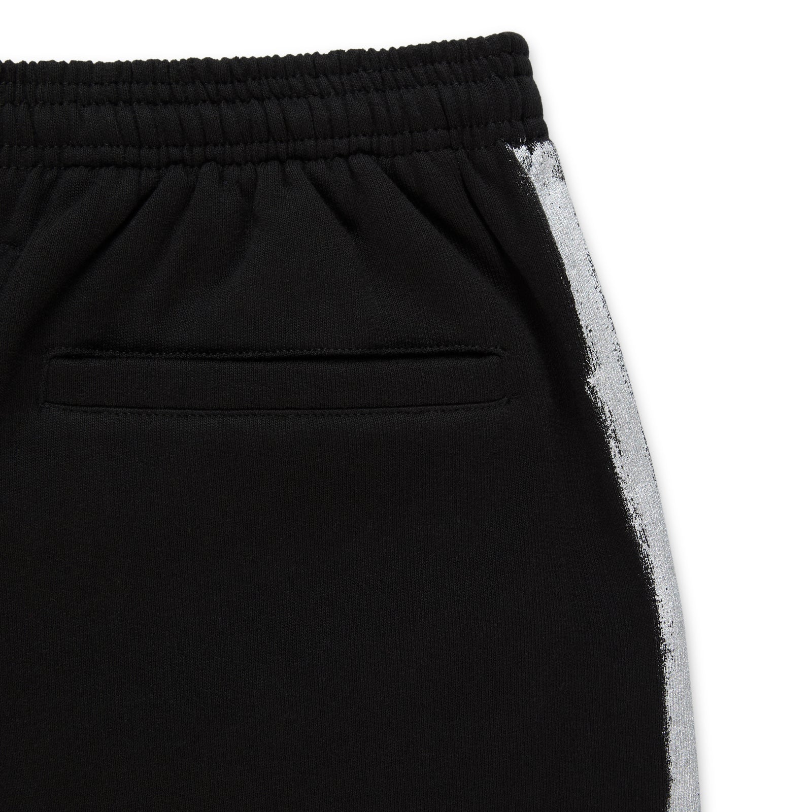 Black cotton fleece sweatpant with elasticized waistband and sprayed-effect silver side stripe.