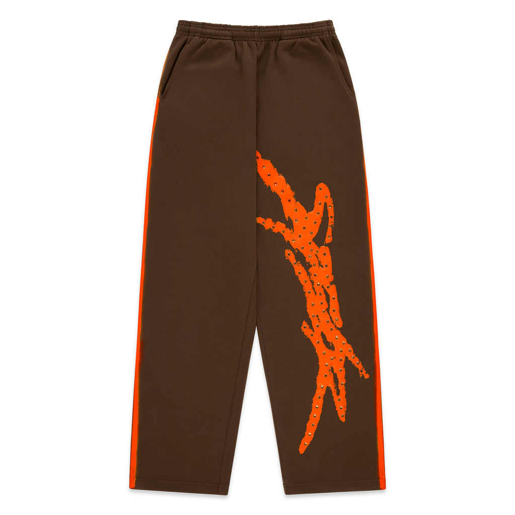 Brown cotton fleece sweatpants with orange sprayed-effect side stripes and rhinestone "SP5DER" logo.