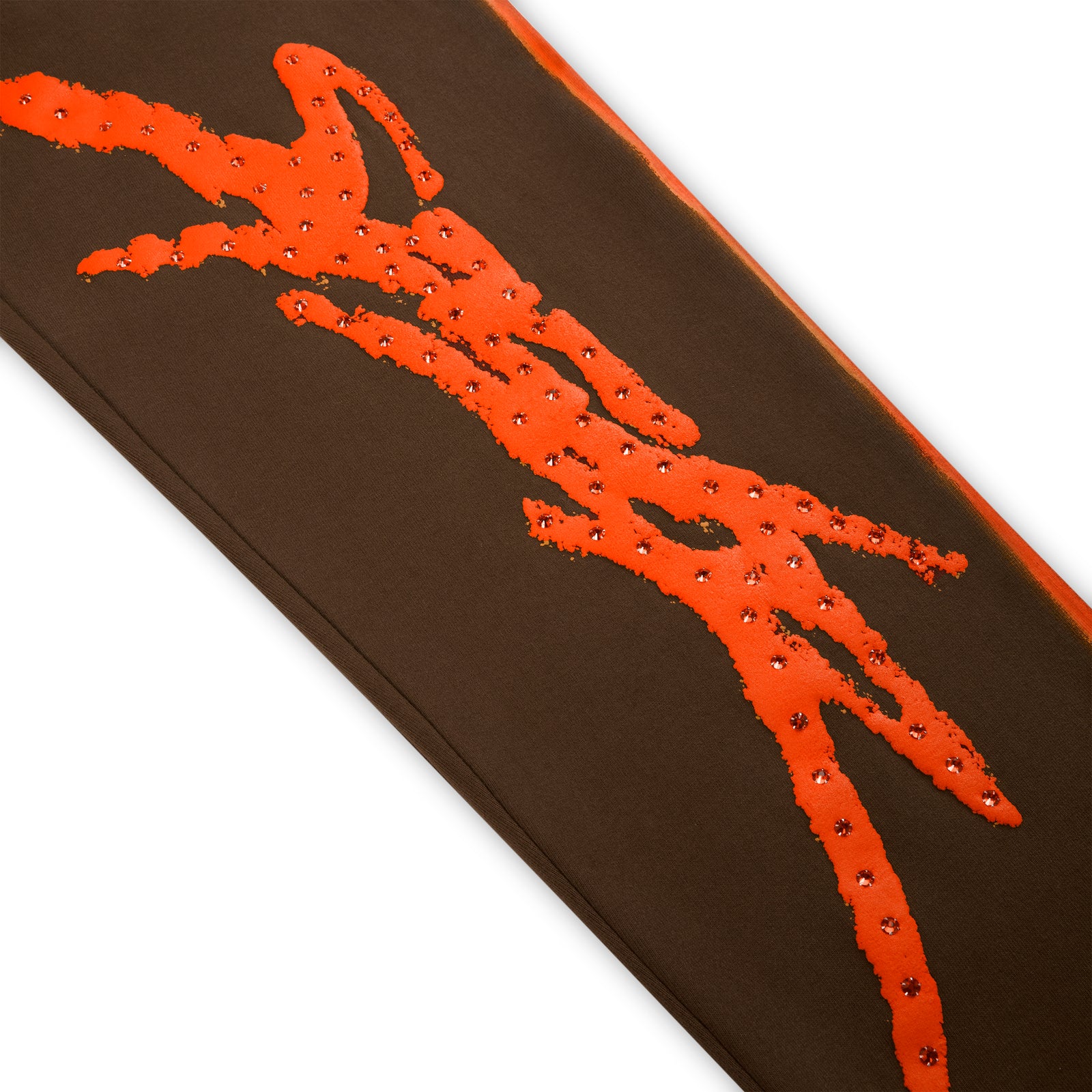 Brown cotton fleece sweatpant with orange rhinestone "SP5DER" logo and sprayed-effect side stripe.