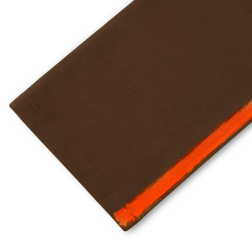 Brown cotton fleece sweatpant with an orange sprayed-effect side stripe.