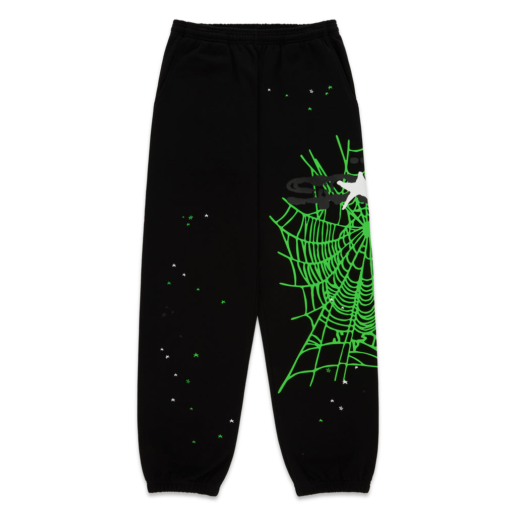 Black 13oz cotton fleece sweatpants with a neon green SP5DER web graphic and scattered star print.