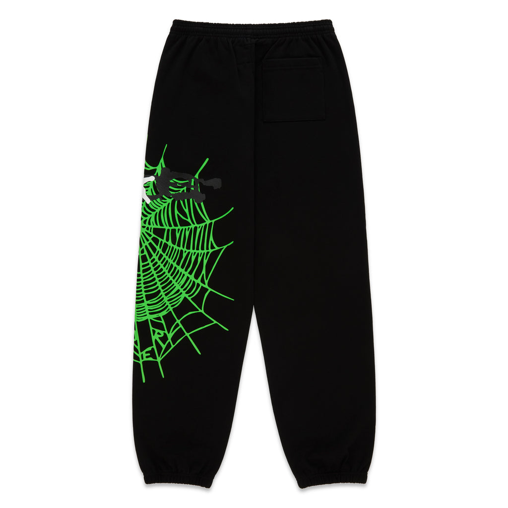 Black HEAVY WEB SWEATPANT with a vibrant green SP5DER web graphic and scattered stars.