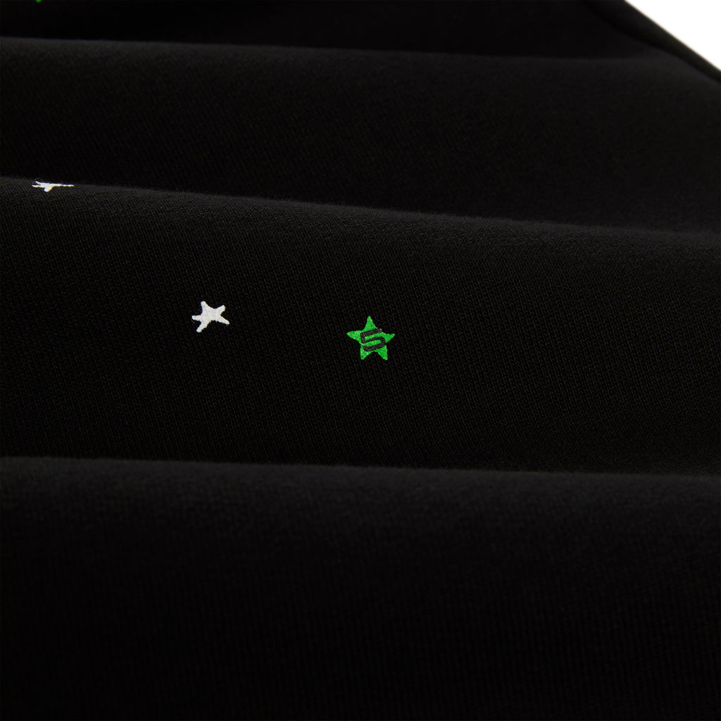 Black HEAVY WEB SWEATPANT with scattered white and green star puff prints.
