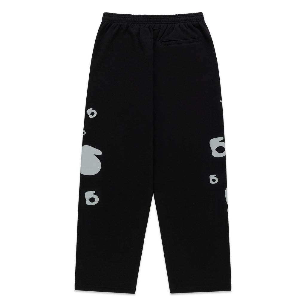 Black cotton fleece sweatpants with reflective 3M '5' and star designs. Elastic waist, wide-leg.