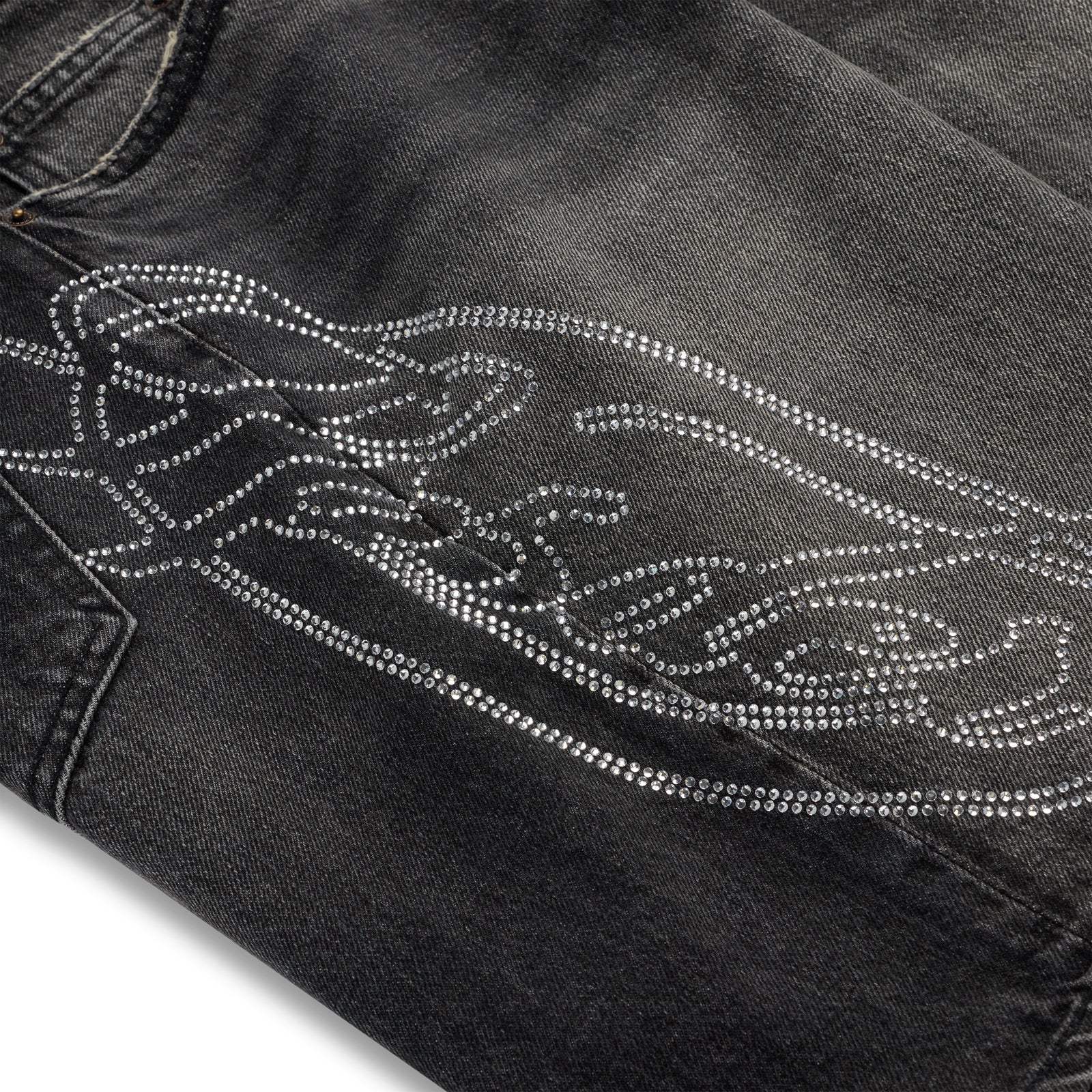 Vintage wash black denim shorts with a large rhinestone web and text design.
