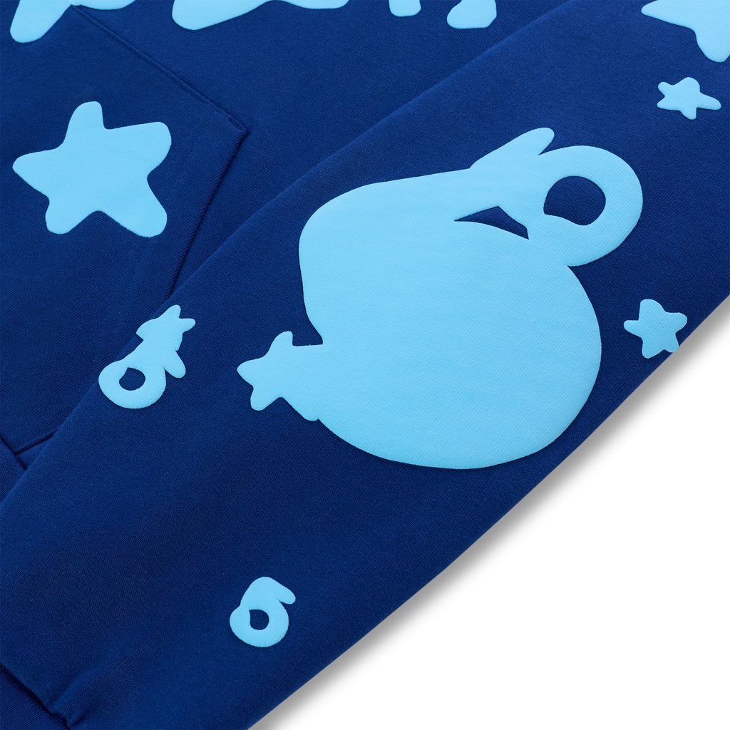 Navy BELUGA HOODIE with light blue puff print 'SP5DER' and star designs on the sleeve.