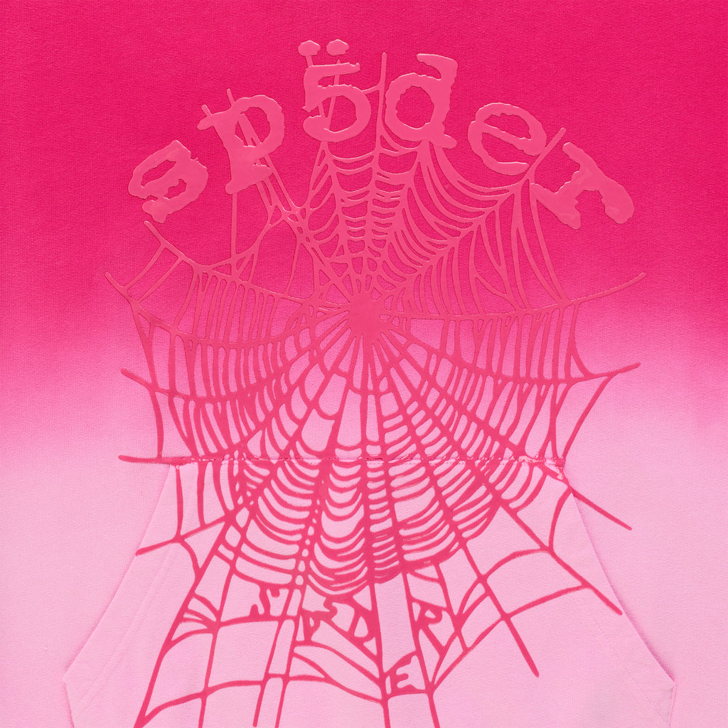 Pink ombre hoodie with a puff print spider web and "SP5DER" text.