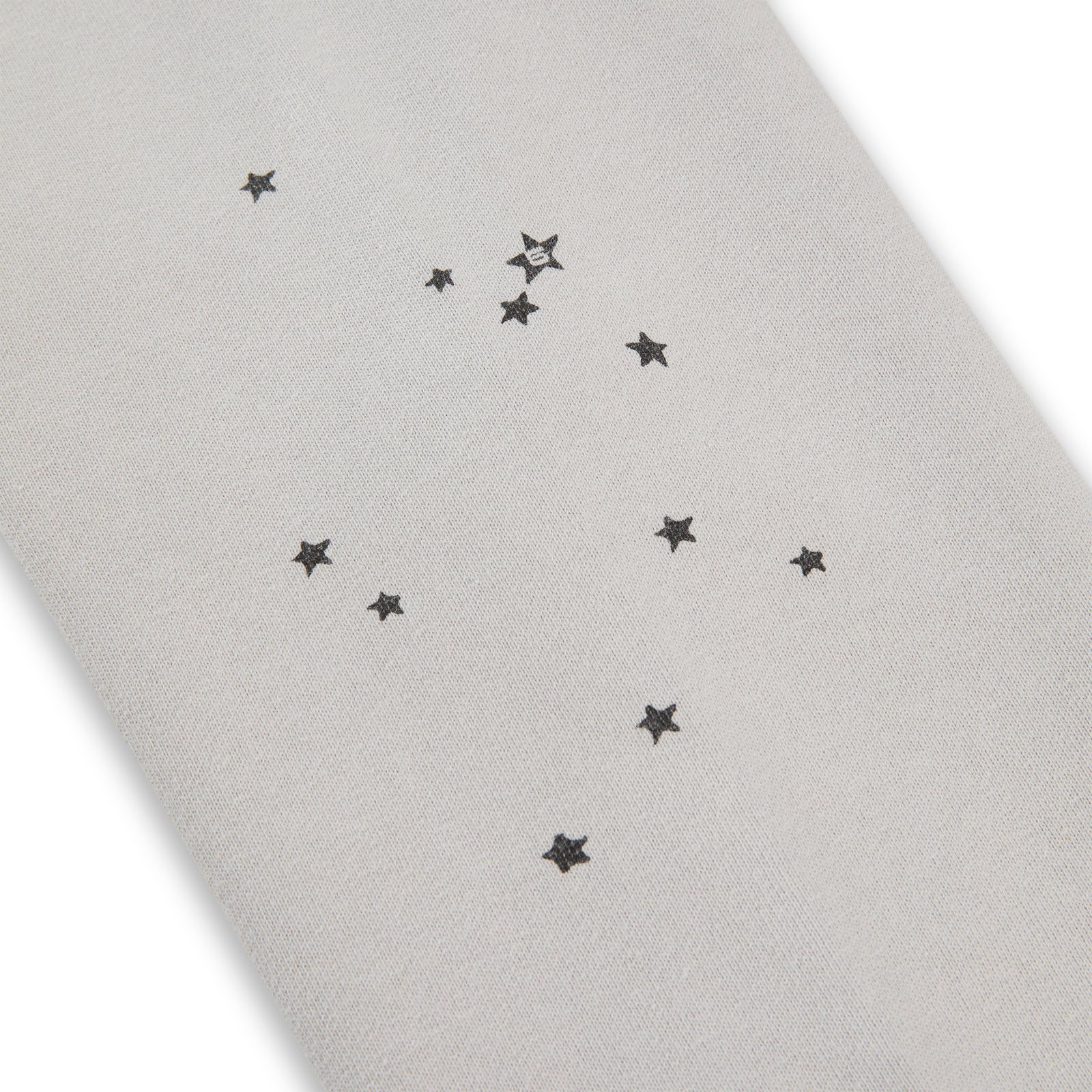 Light grey 100% cotton fleece hoodie with scattered black star prints.