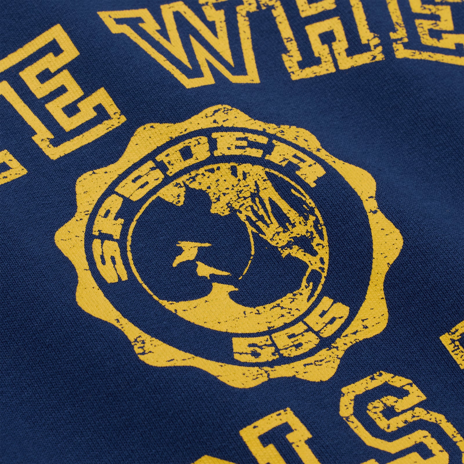 Navy blue 100% cotton brushed fleece crewneck with a distressed yellow graphic print design on the front.