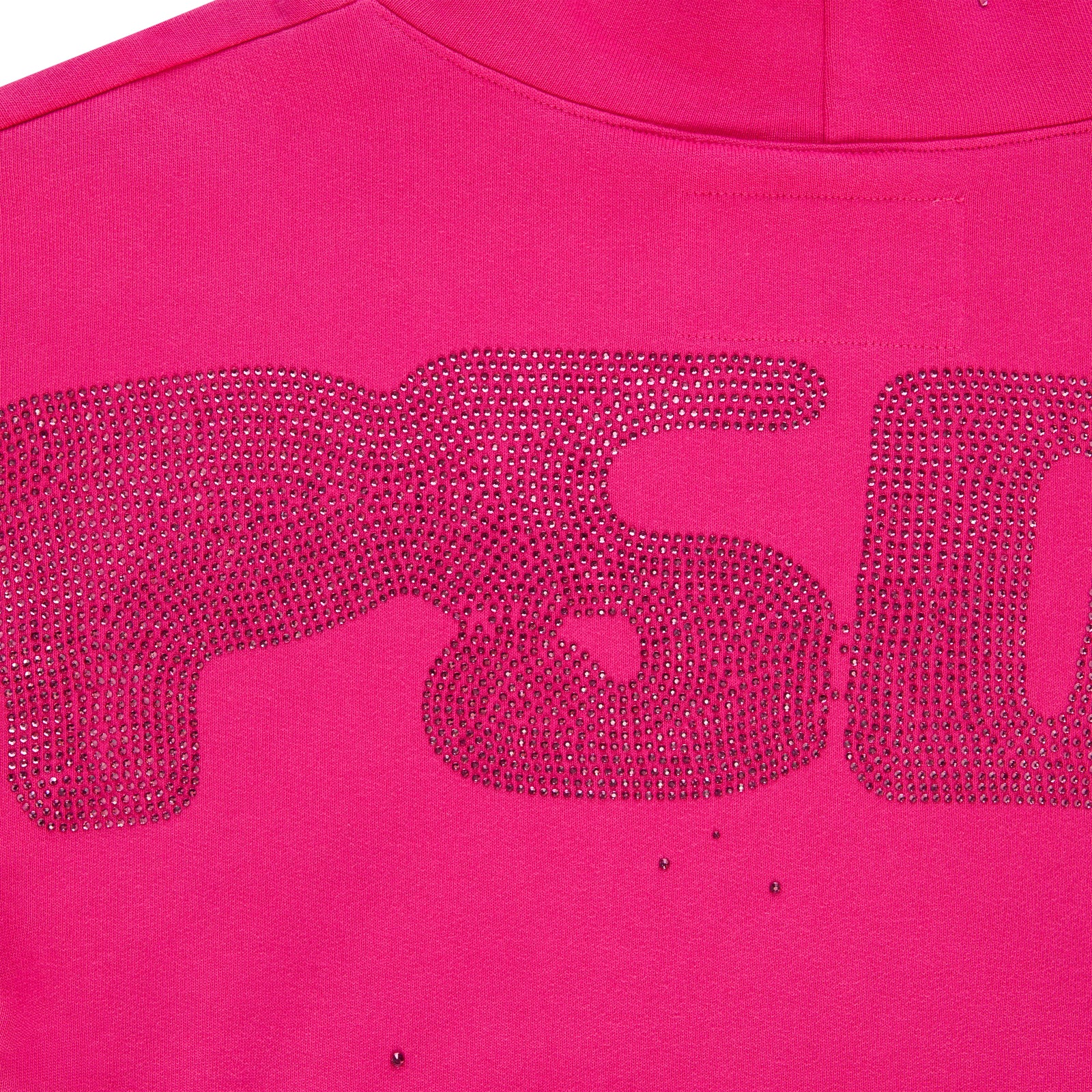 Close-up of a vibrant pink cotton fleece hoodie with a rhinestone design.