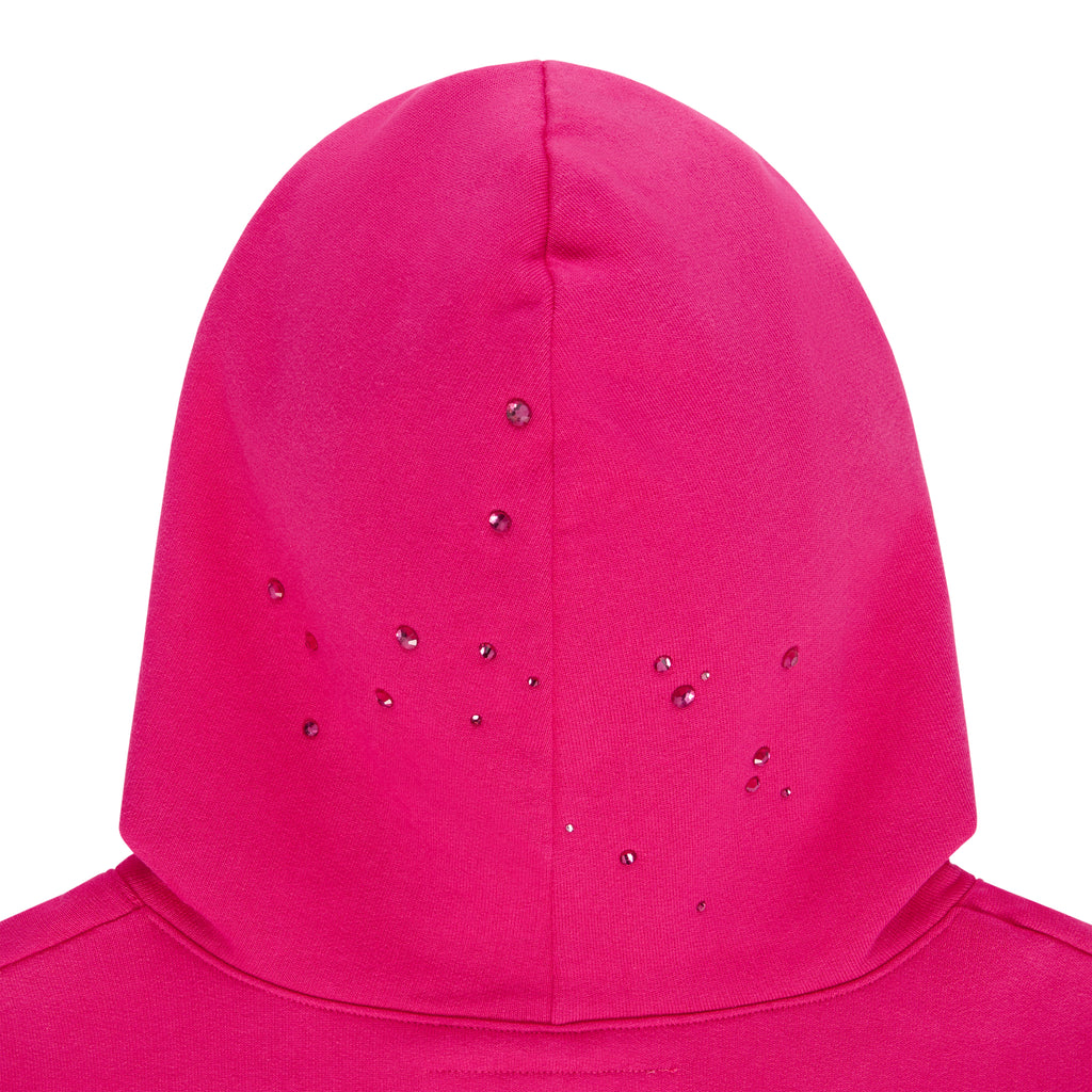 Pink cotton fleece hoodie with scattered rhinestone design on the back of the hood.
