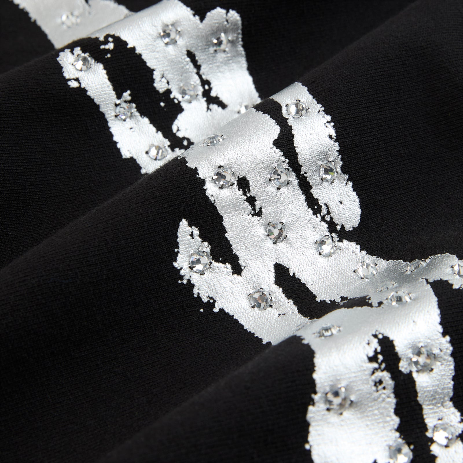 Black cotton fleece hoodie with metallic silver graphic and rhinestone accents.