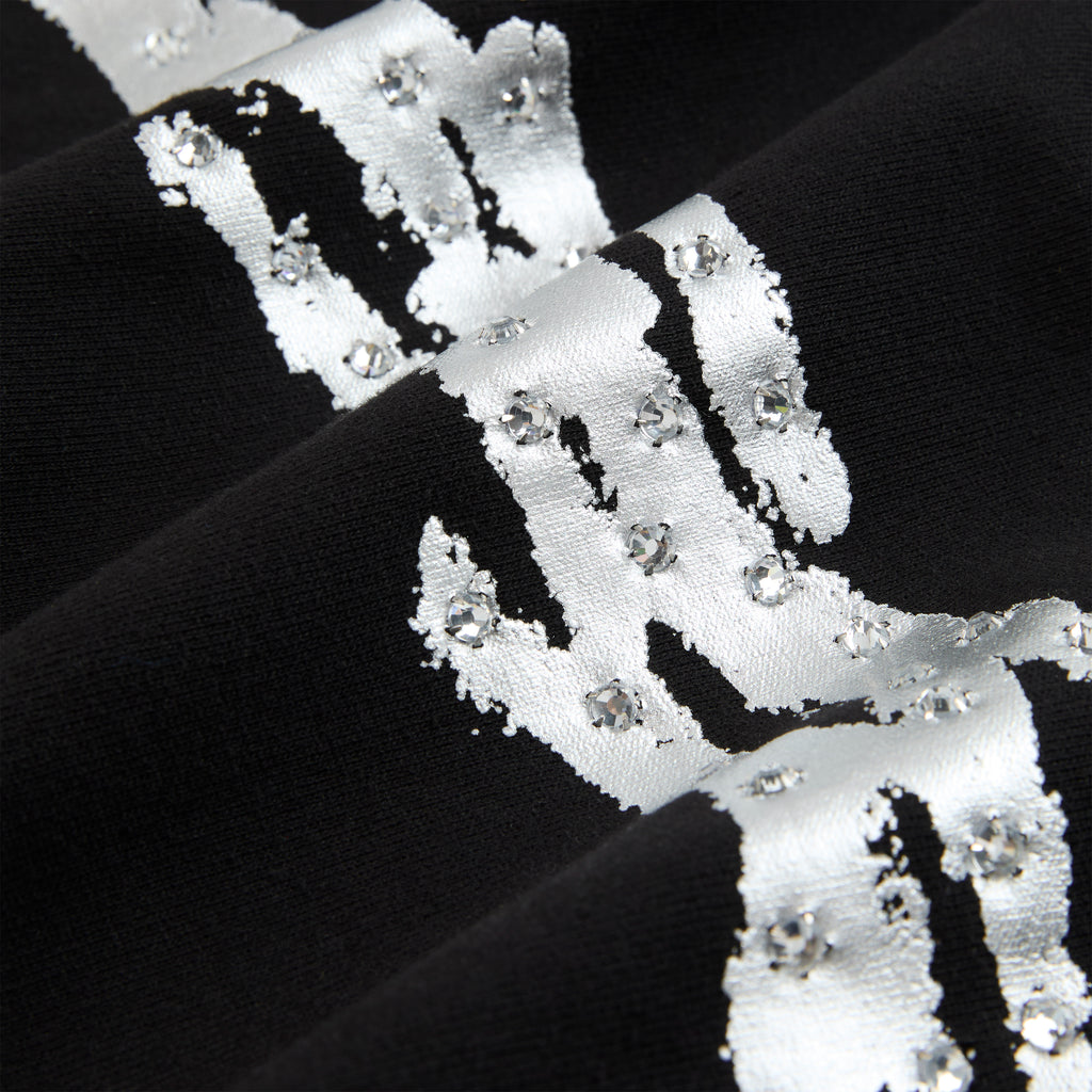 Black cotton fleece hoodie with metallic silver graphic and rhinestone accents.