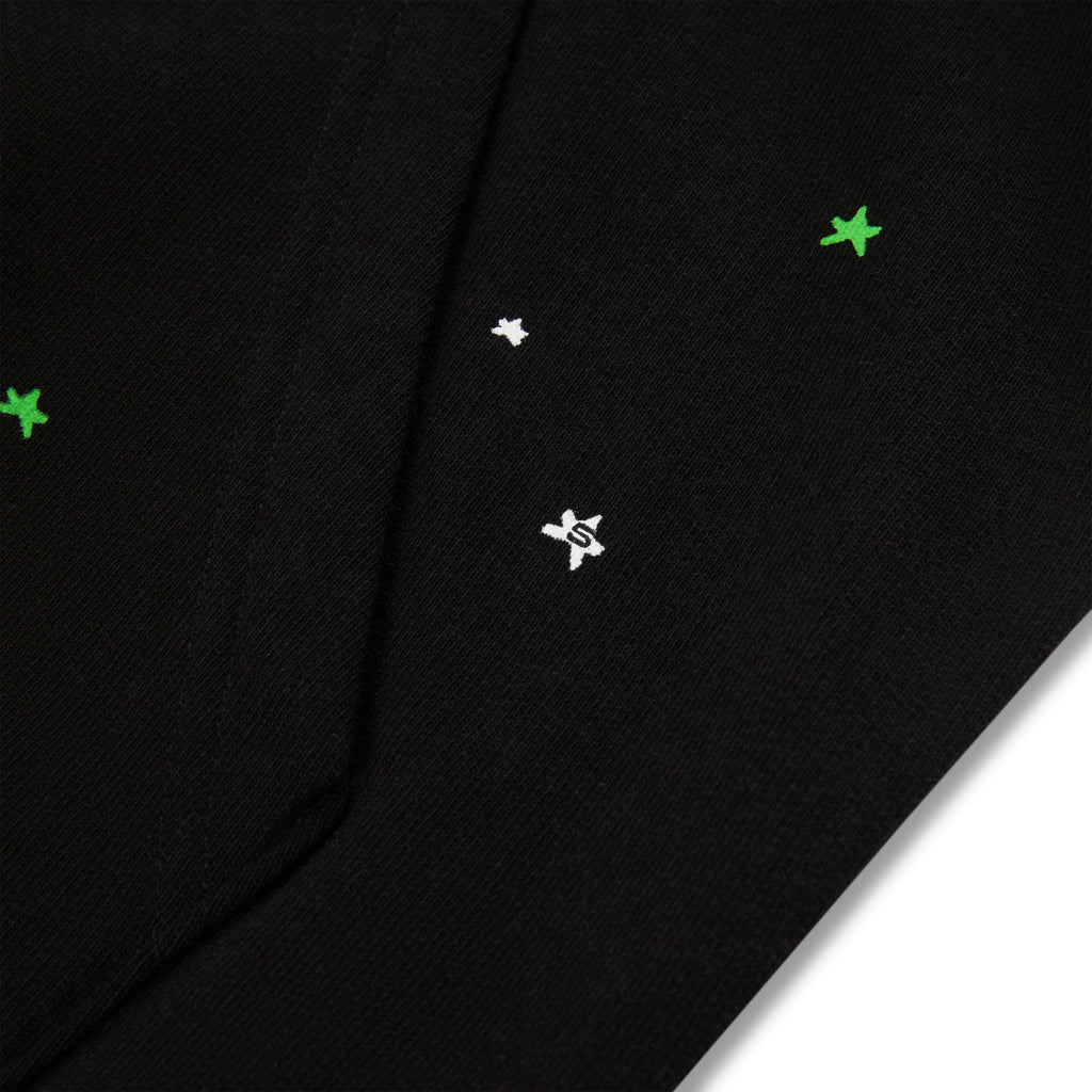 Black heavy web hoodie with scattered green and white star puff prints.