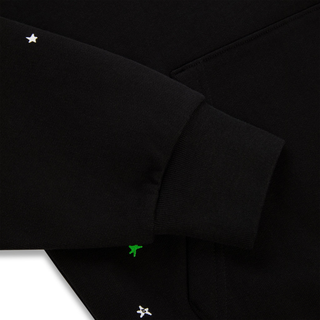Black heavy web hoodie with white stars and green puff print details.