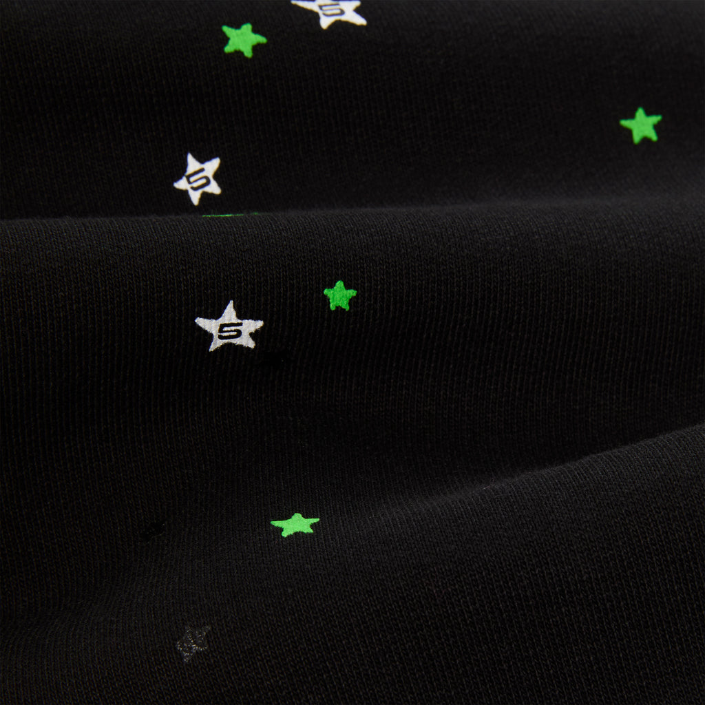 Black 13oz cotton fleece HEAVY WEB HOODIE with scattered green and white star puff prints.