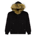 Black 13oz cotton fleece Garibaldi zip-up hoodie with faux fur hood trim, SP5DER patches, patterned sleeves with pink stone appliqué, and studded pockets.