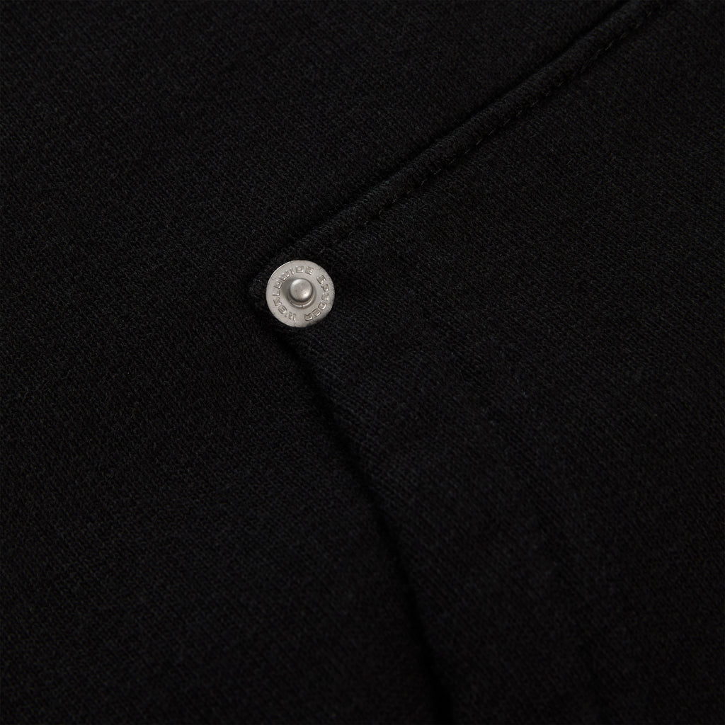 Black 13oz cotton fleece Garibaldi zip-up with silver studded pocket detail.