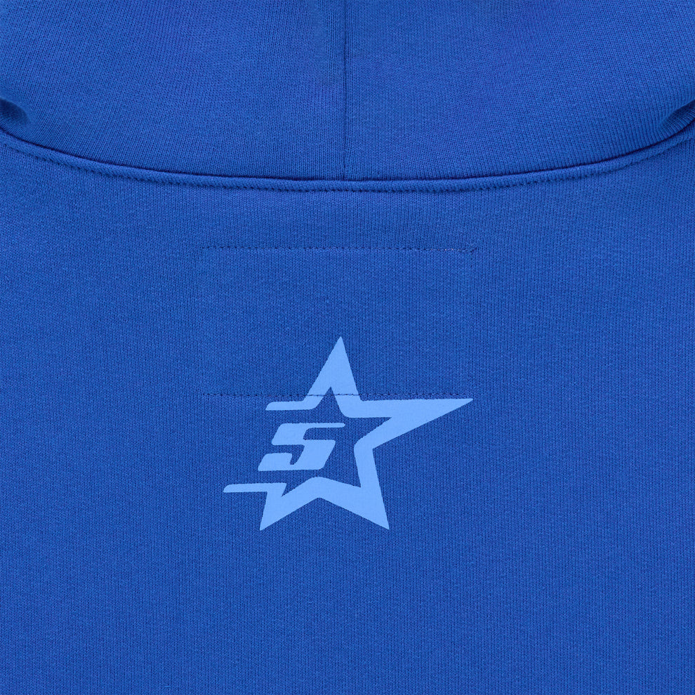 Close-up of a blue hoodie with a light blue star and "SG" logo on the back.