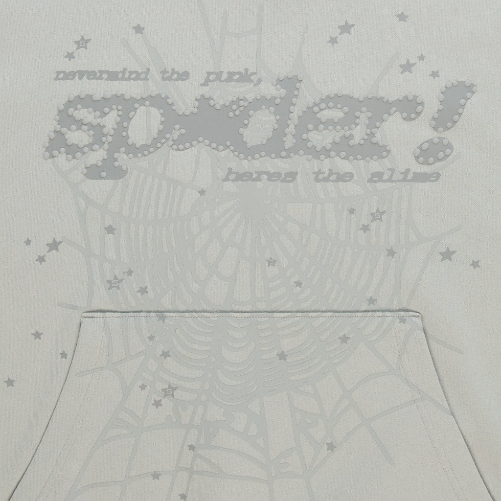 Light grey cotton fleece hoodie with "SP5DER!" puff print, spider web, and scattered star designs.