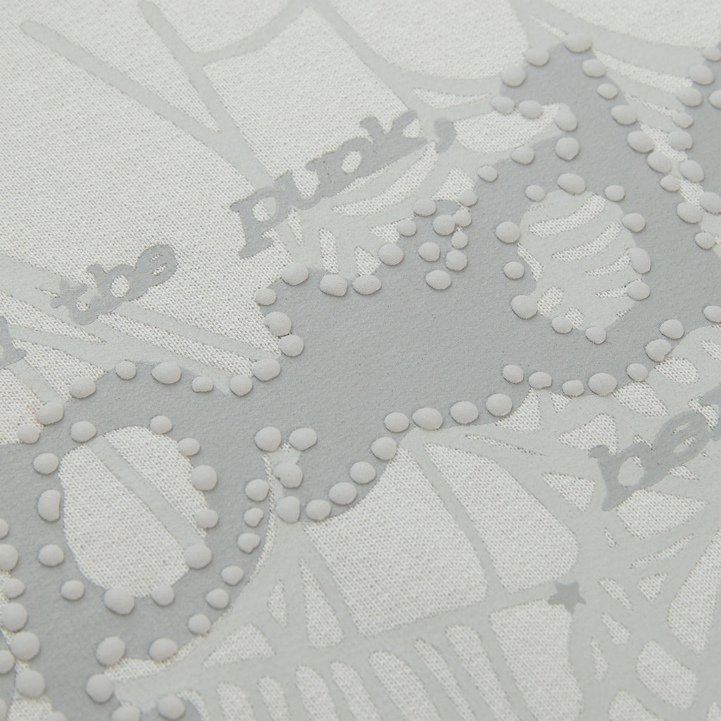 Close-up of a white cotton fleece hoodie with gray puff print "Punk" text and spider web design.