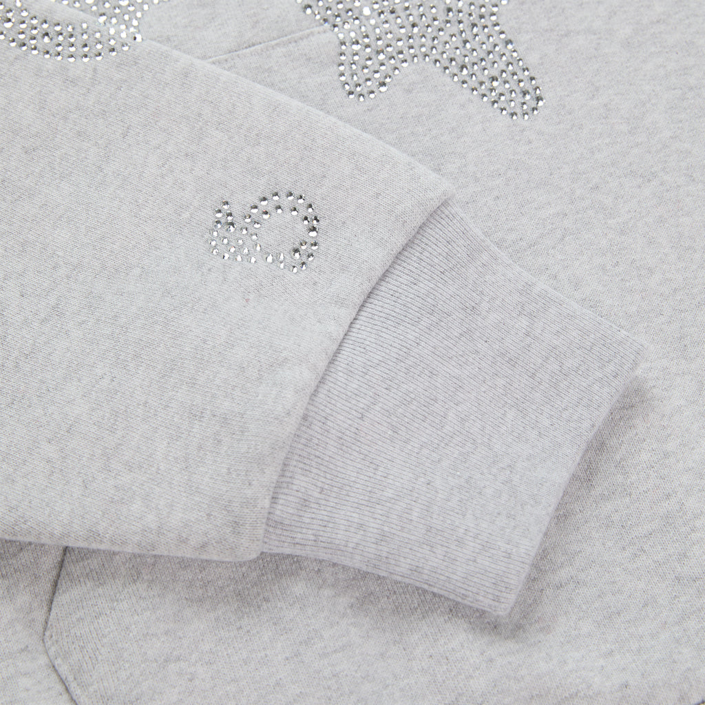 Light grey cotton fleece hoodie with rhinestone 'SP5DER' and star design on sleeve.