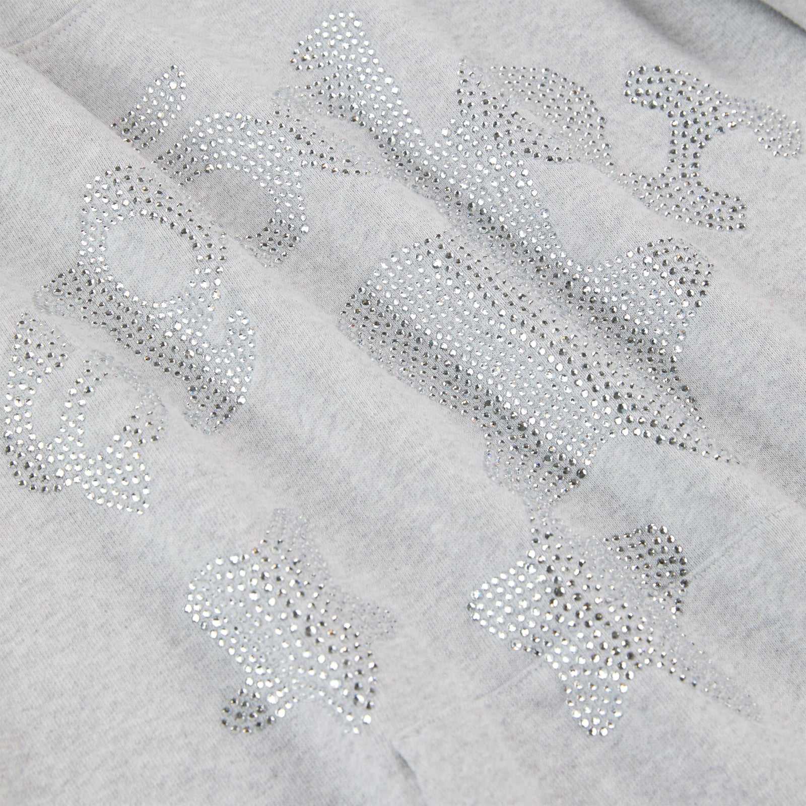 Gray 100% cotton fleece hoodie with rhinestone "SP5DER" text and star embellishments.
