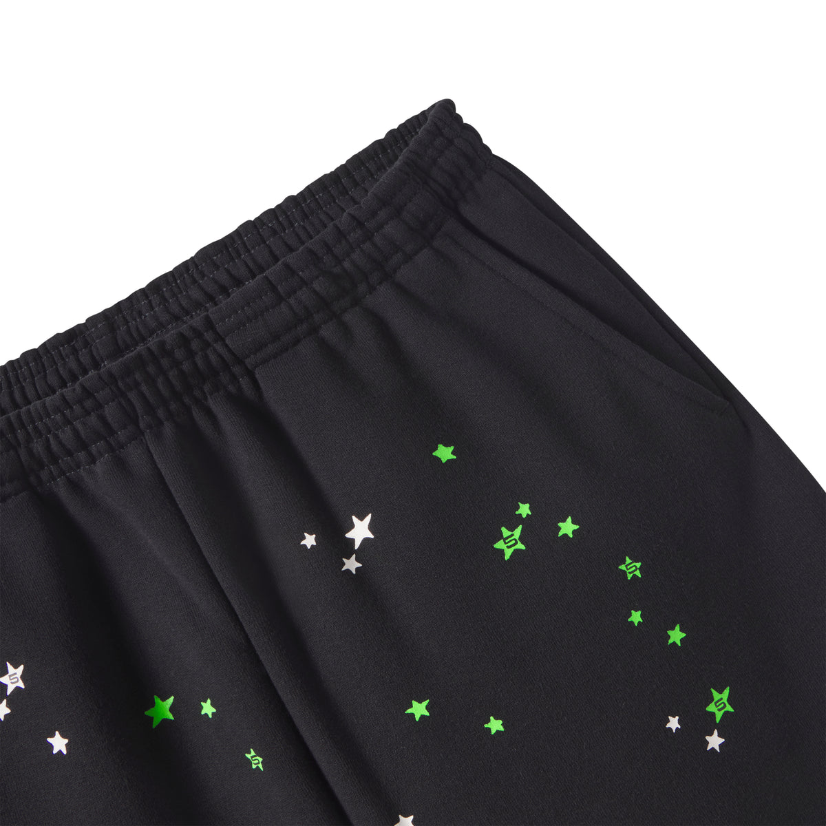 Black 13oz cotton fleece sweatpants with an elasticized waistband and scattered green and white star graphic prints.