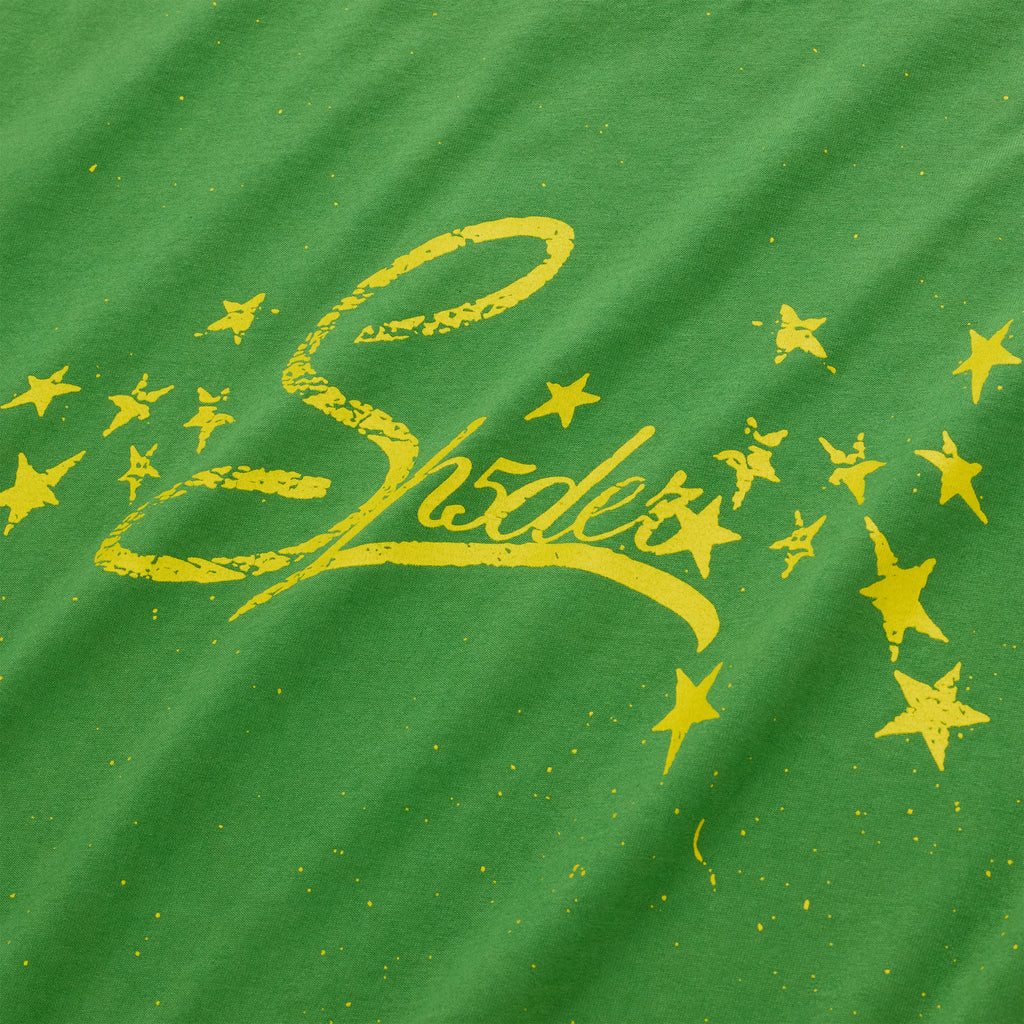 Green cotton tee with yellow "Shades" graphic and scattered stars.