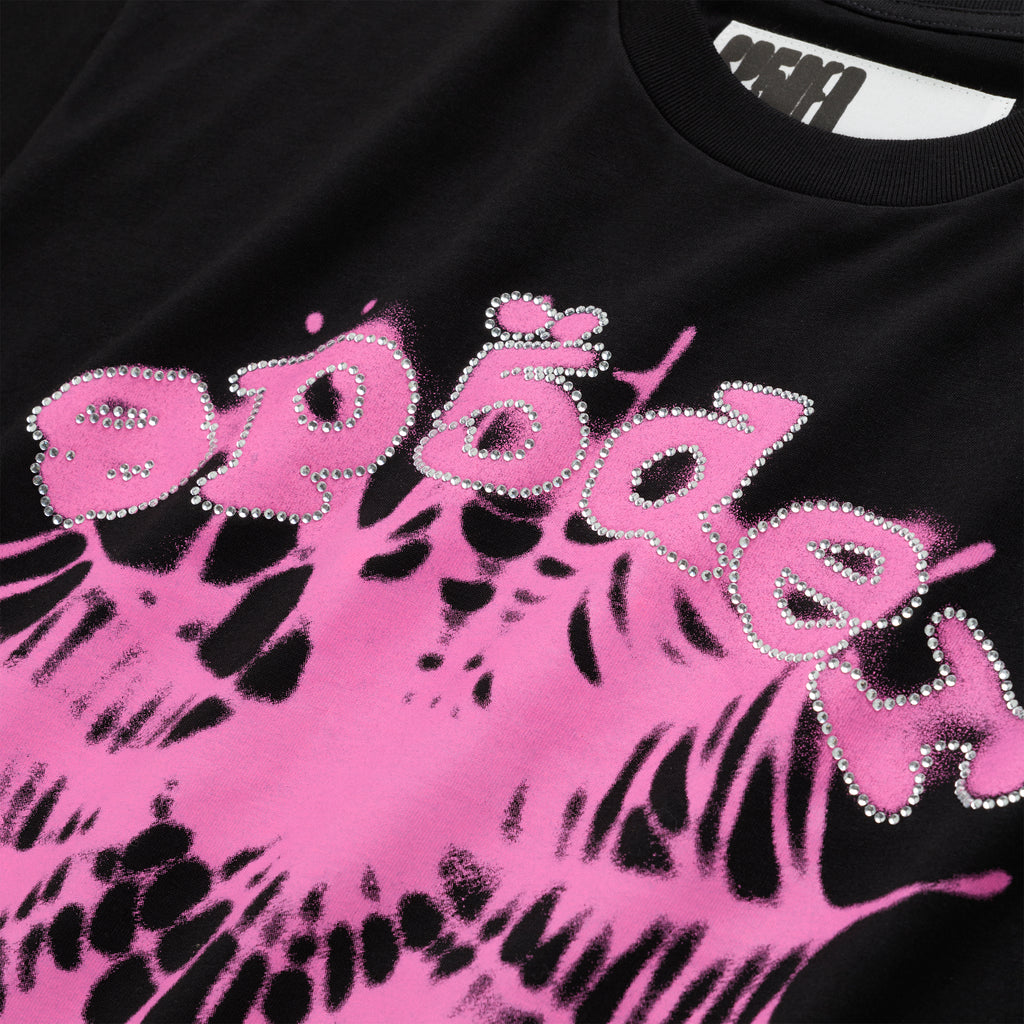 Black cotton tee with "SP5DER" text in rhinestones over a pink web graphic.