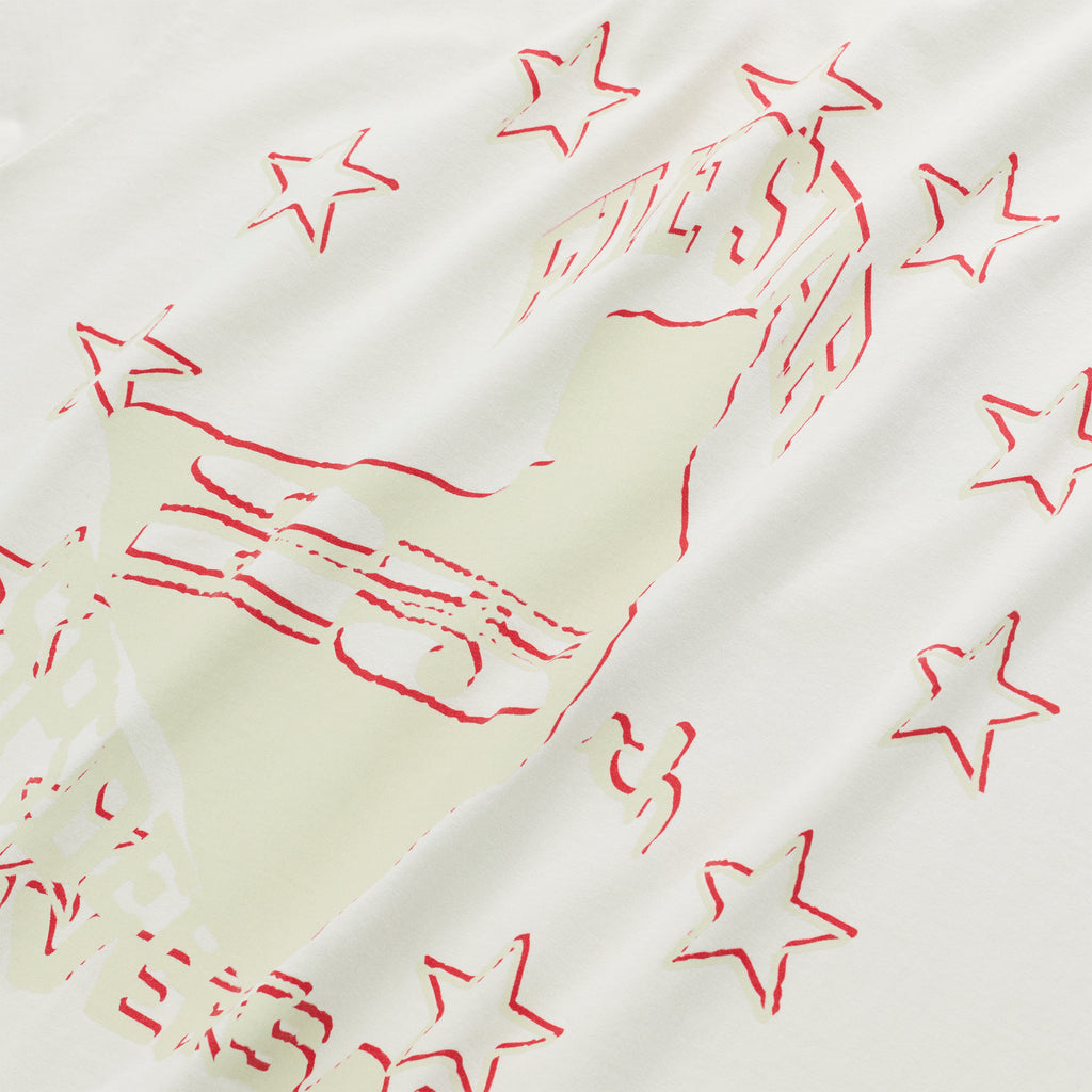 White cotton ANNIVERSARY TEE with a light green hand graphic and red stars.