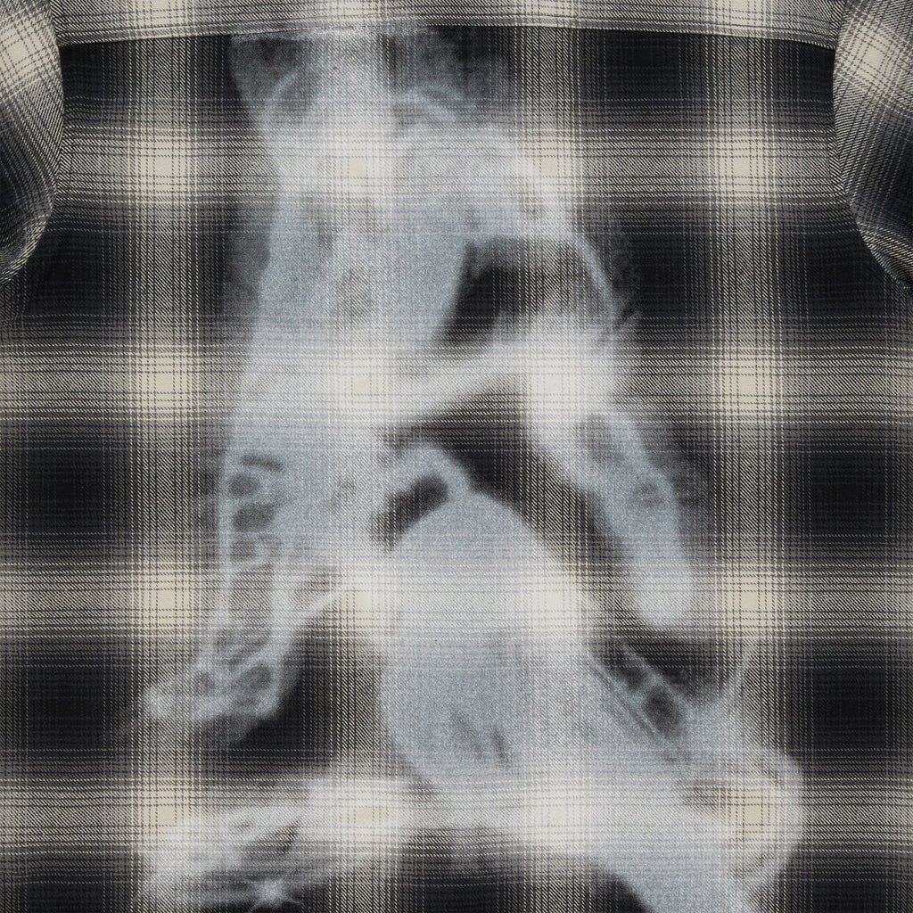 Black and cream plaid cotton flannel shirt with a faded graphic print on the back.