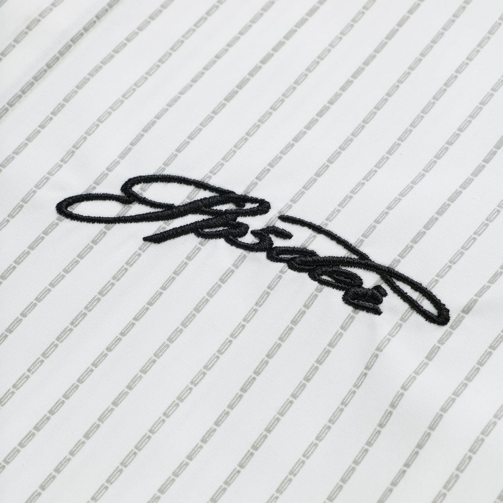 White woven cotton oxford button-down shirt with gray pinstripes and black embroidered script logo.