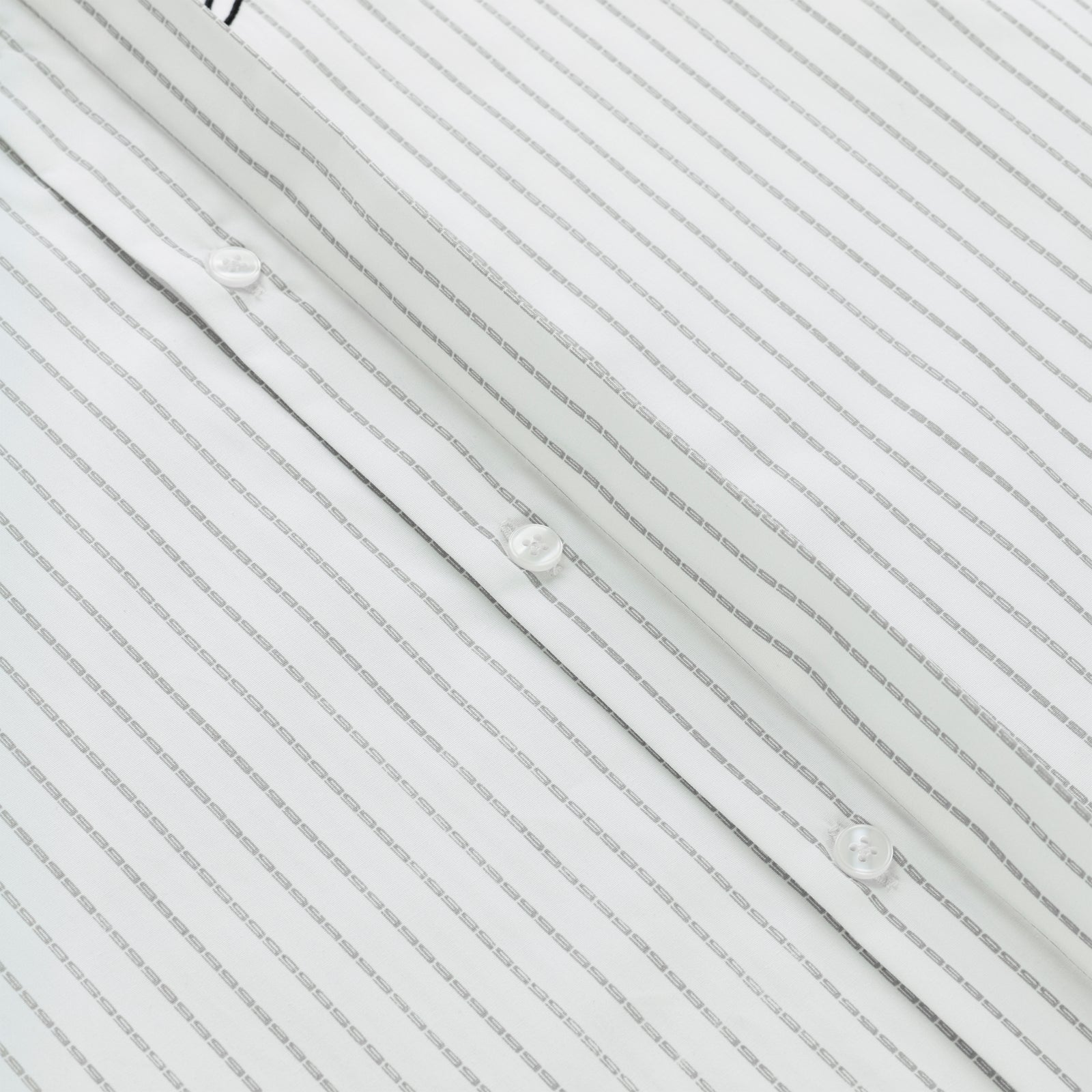White woven cotton button-down shirt with thin gray pinstripes and white buttons.