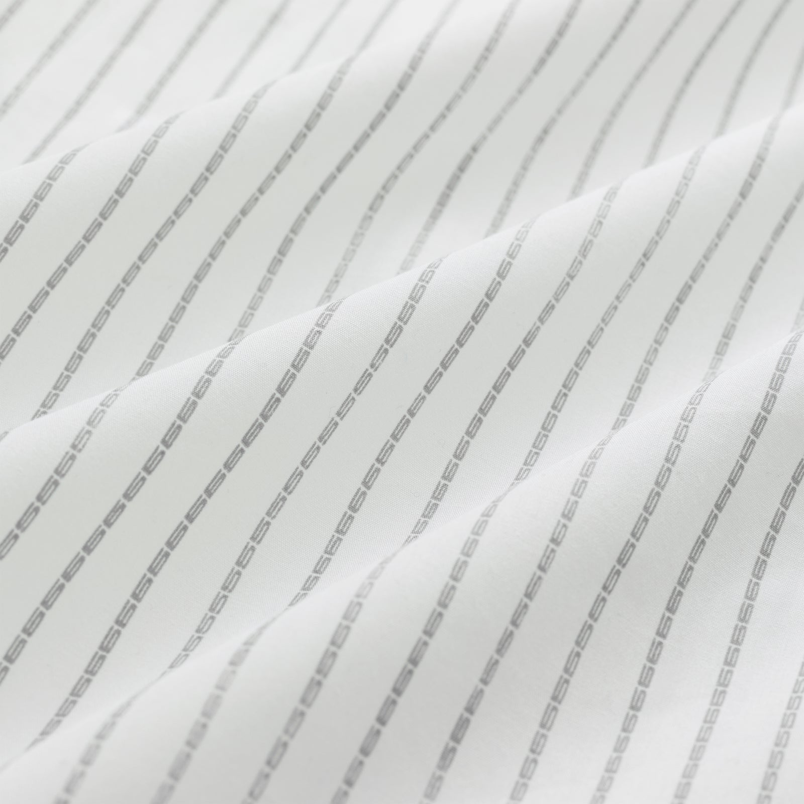 White woven cotton fabric with subtle gray 5-pinstripe design, showing gentle folds.