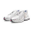 SP5DER x adidas F50 Adizero metallic silver sneakers with pink accents, mesh, chrome overlays, and a removable charm.