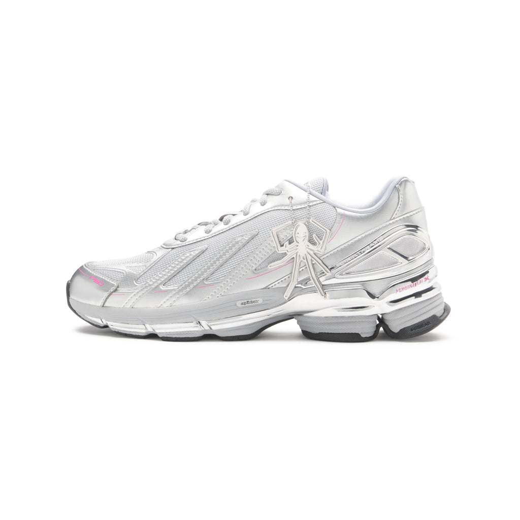 SP5DER x ADIDAS F50 ADIZERO metallic silver sneaker with mesh, chrome overlays, pink accents, and a spider charm.