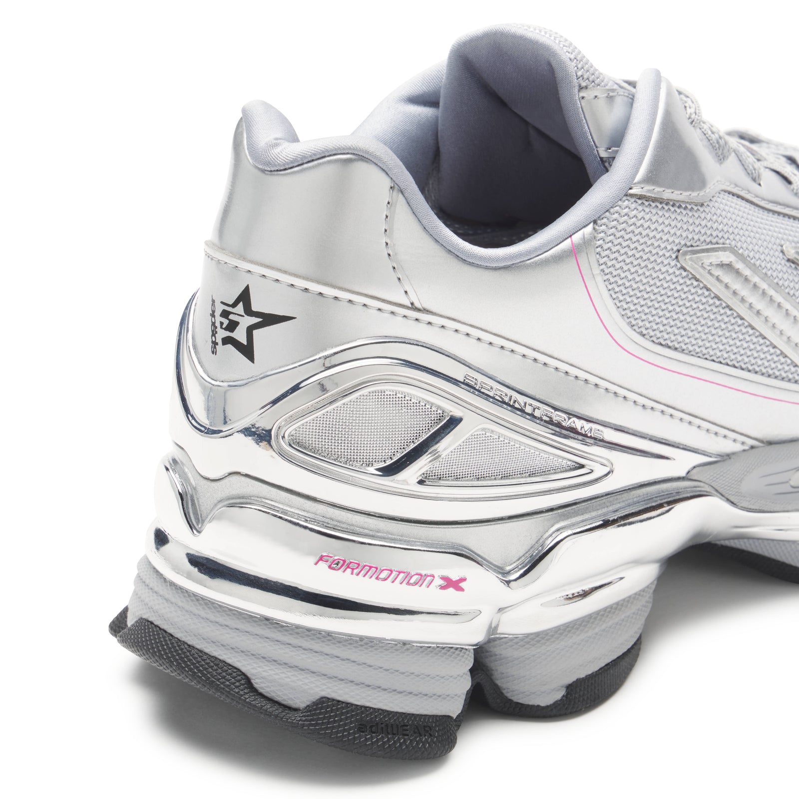 SP5DER x ADIDAS F50 ADIZERO sneaker with metallic silver synthetic and mesh, chrome overlays, pink accents, and co-branding.