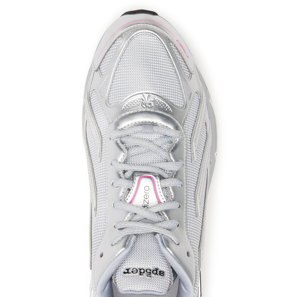 SP5DER x ADIDAS F50 ADIZERO metallic silver sneaker with mesh, chrome overlays, pink accents, and co-branding.