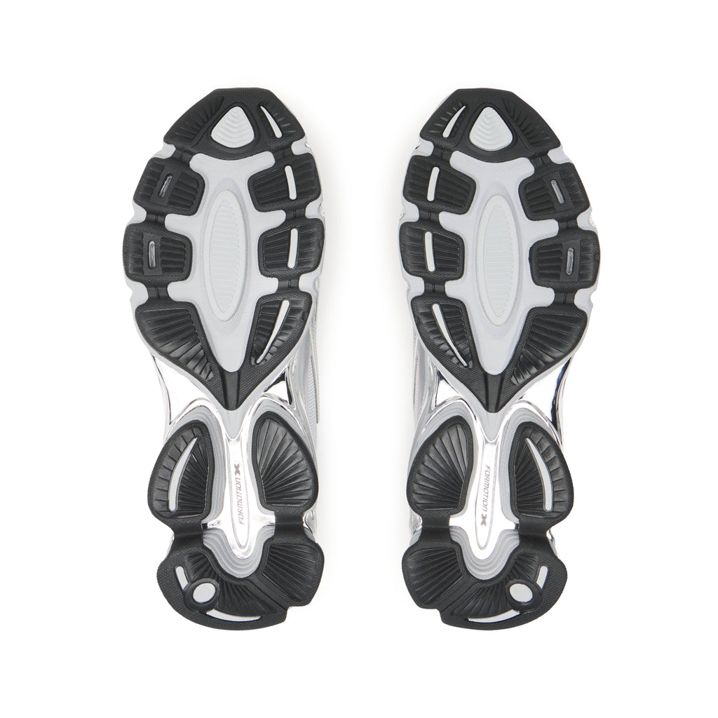 SP5DER x ADIDAS F50 ADIZERO sneakers with black, white, and chrome-finish rubber tread outsoles.