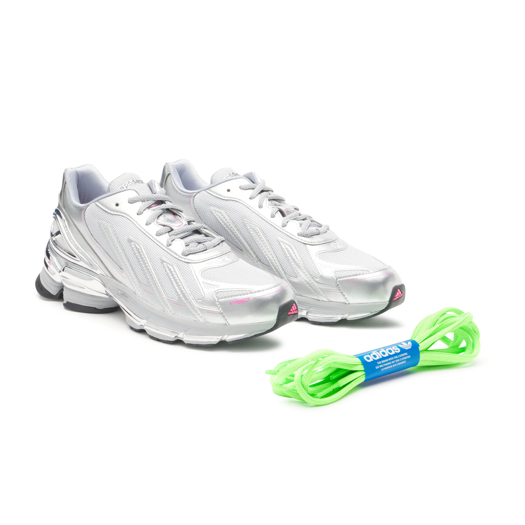 SP5DER x ADIDAS F50 ADIZERO sneakers with metallic silver upper, pink accents, and a neon green lace set.