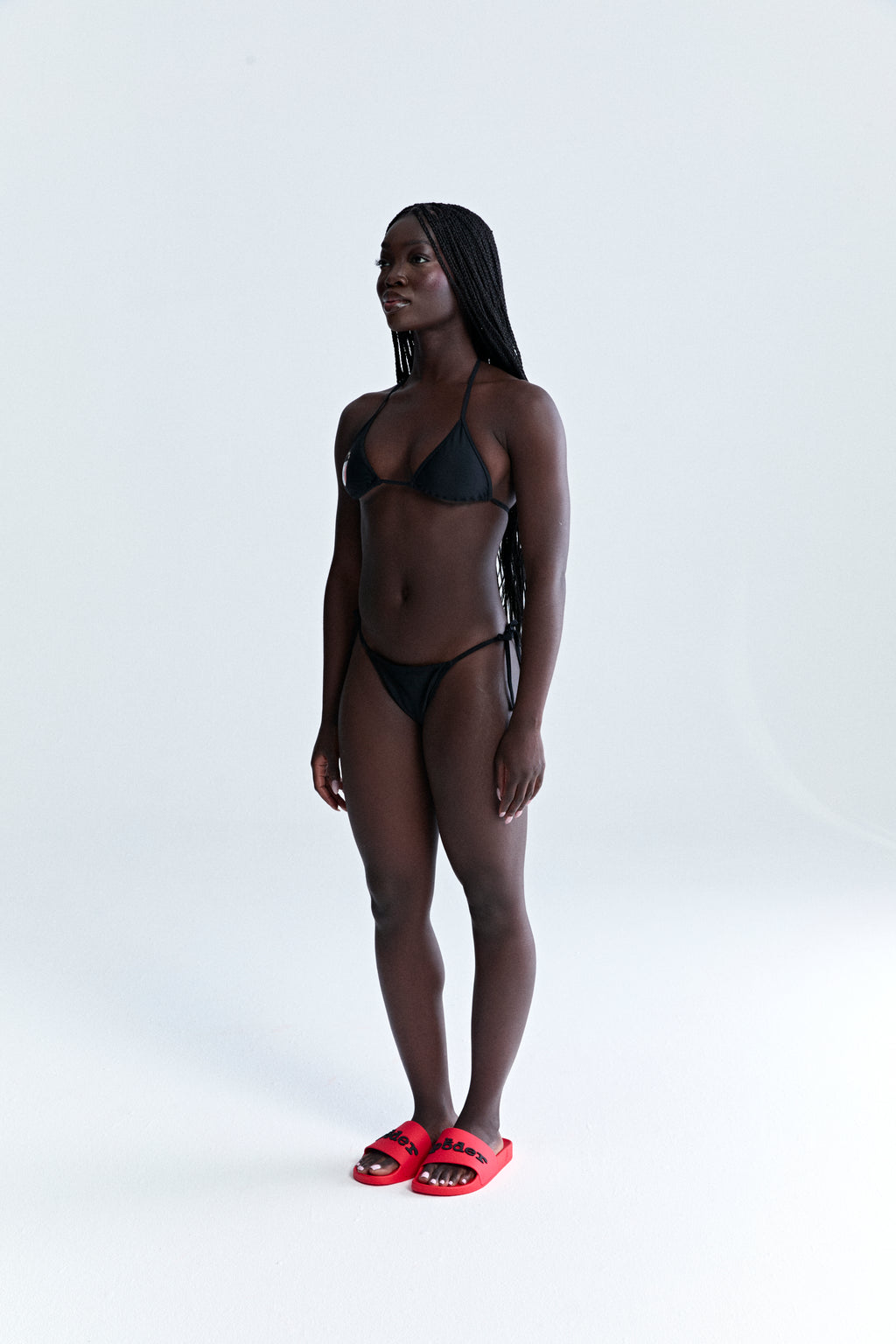 Black stretch nylon jersey ARAIGNÉE bikini with triangle top and rope ties.