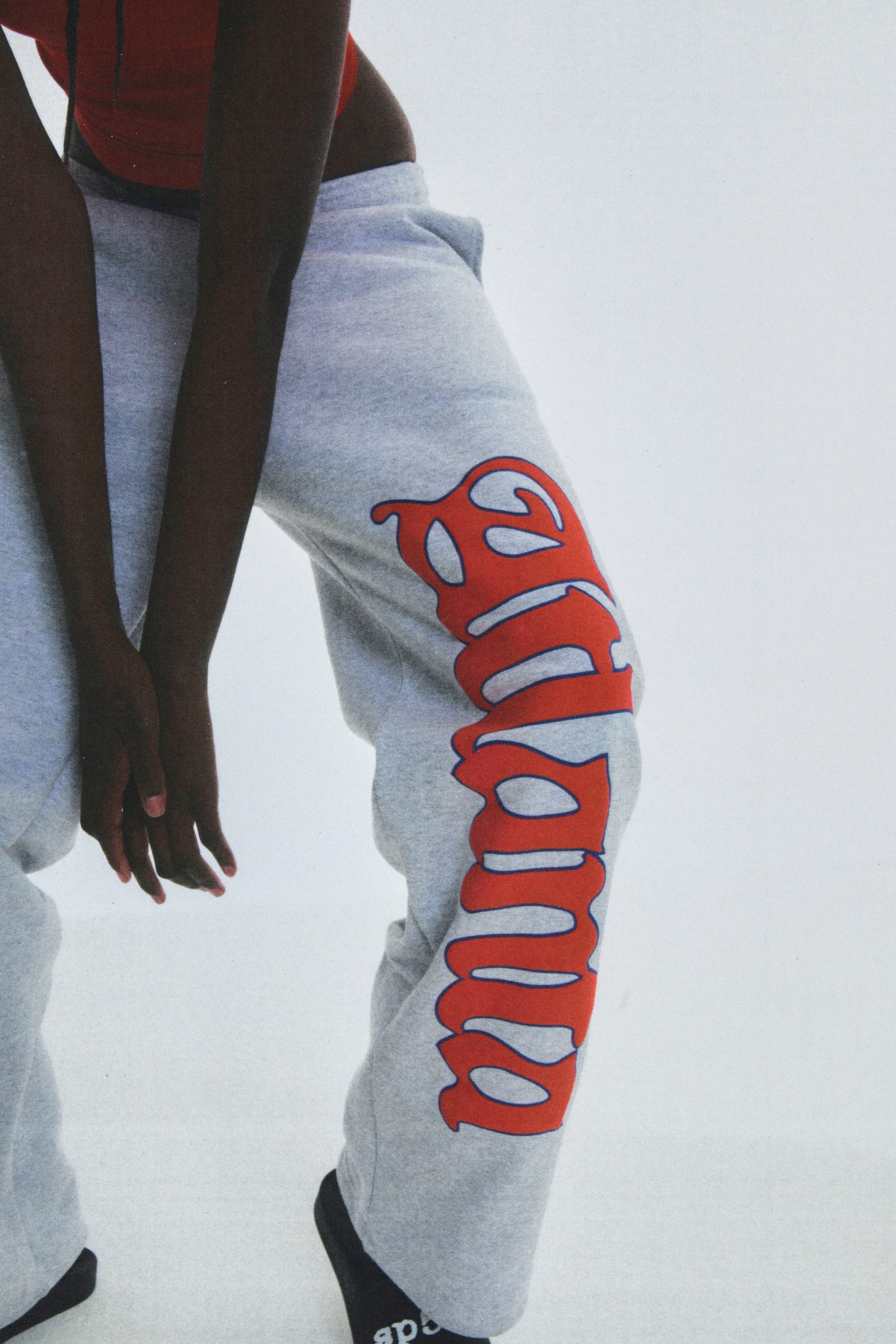 Grey cotton fleece wide-leg sweatpants with "Atlanta" script and scattered stars.