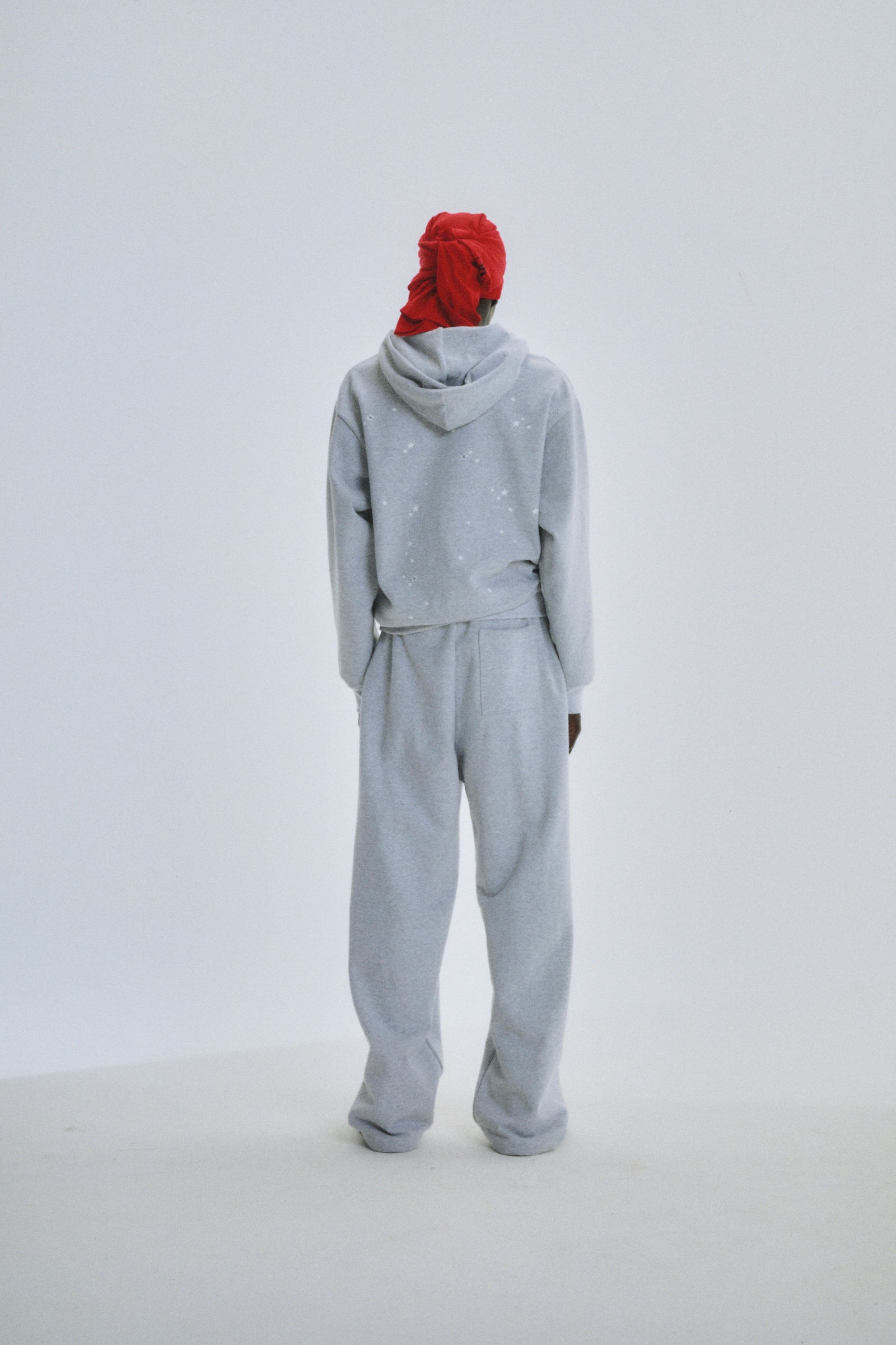 Grey cotton fleece full zip hoodie and sweatpants with scattered star print.