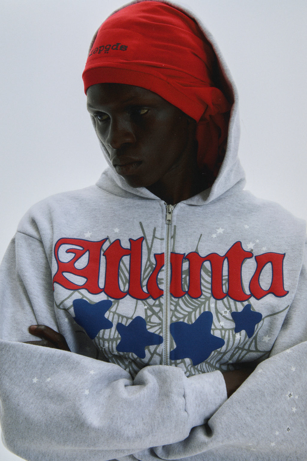 Grey 13oz cotton fleece Atlanta Full Zip Hoodie with red script, web, blue stars, and scattered star print.