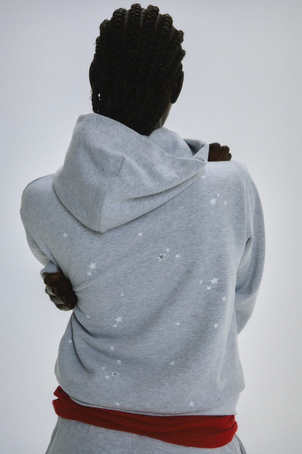 Light grey 100% cotton fleece Atlanta Full Zip Hoodie with scattered star print, seen from behind.