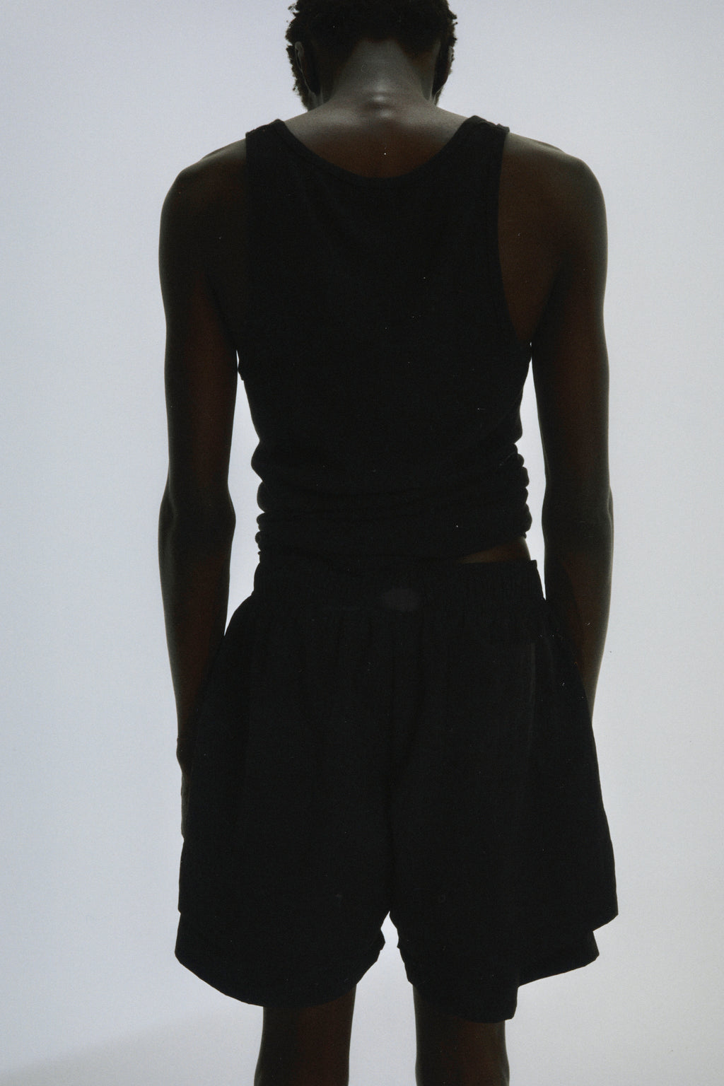 Black Beluga Double Layer Short, 4oz water repellent nylon, high-low design, with patch back pocket.