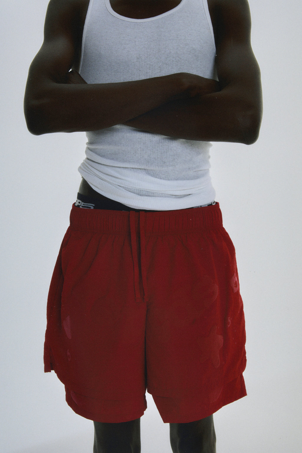 Red Beluga Double Layer Short, 4oz water repellent nylon, high-low design, puff print, elastic waistband.