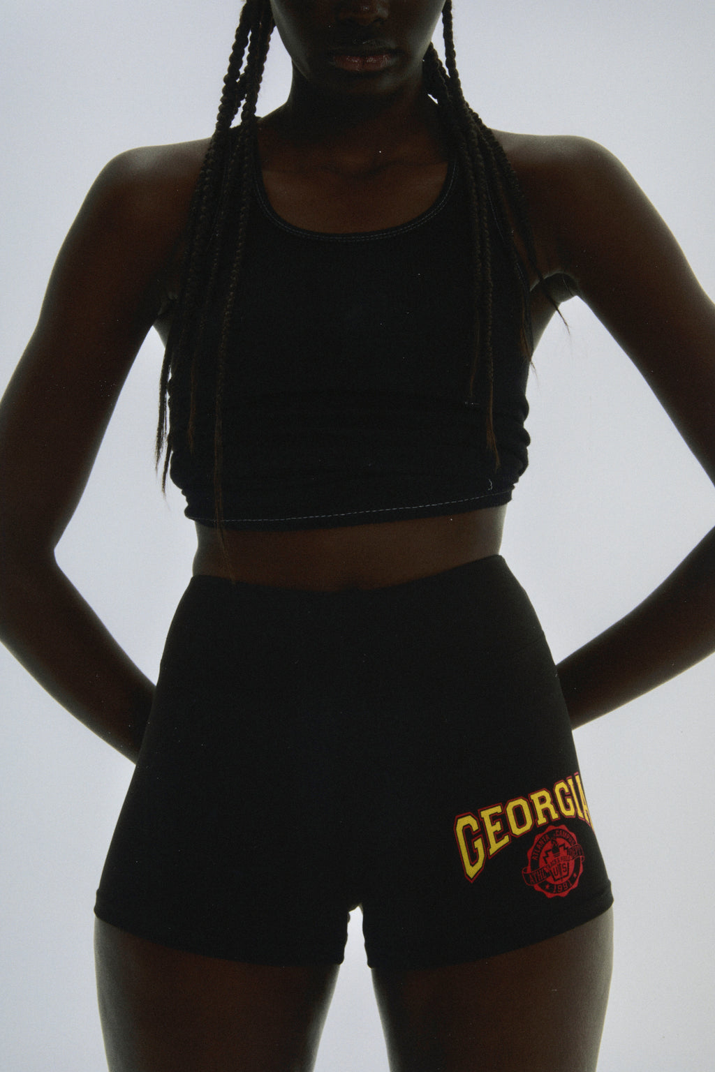 Black stretch cotton jersey shorts with "GEORGIA" collegiate graphic and elasticized waistband.